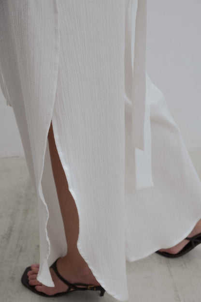 CALÇA COM FENDA